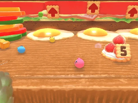 Fall Guys but Kirby game logo featuring the pink character Kirby